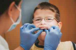 Little boy getting orthodontic treatment