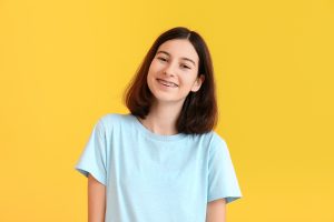 portrait of a girl smiling with her metal braces