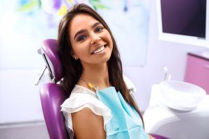 patient smiling in dental chair